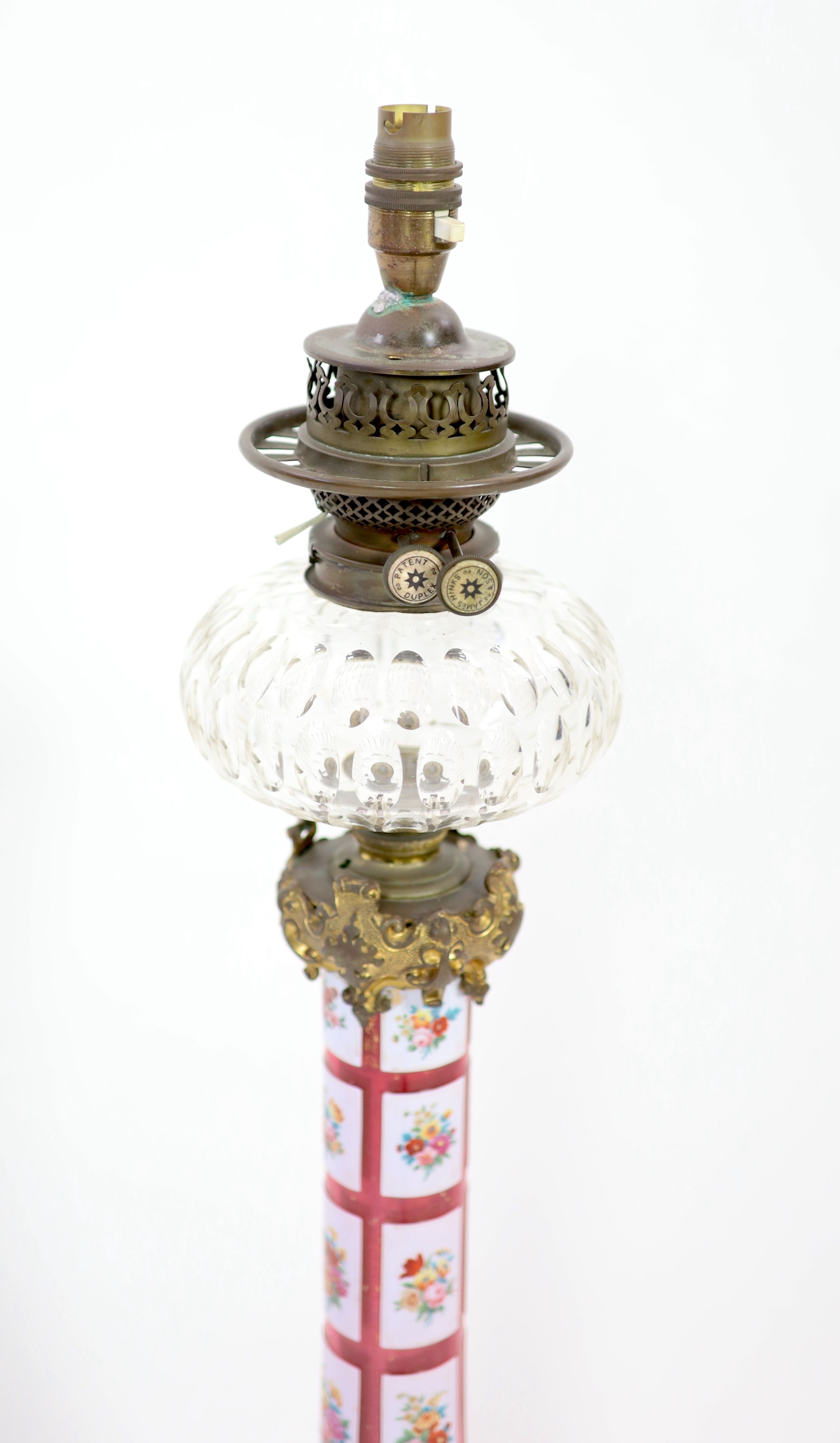 A Victorian ormolu mounted Bohemian ruby overlaid glass oil lamp, height 79cm